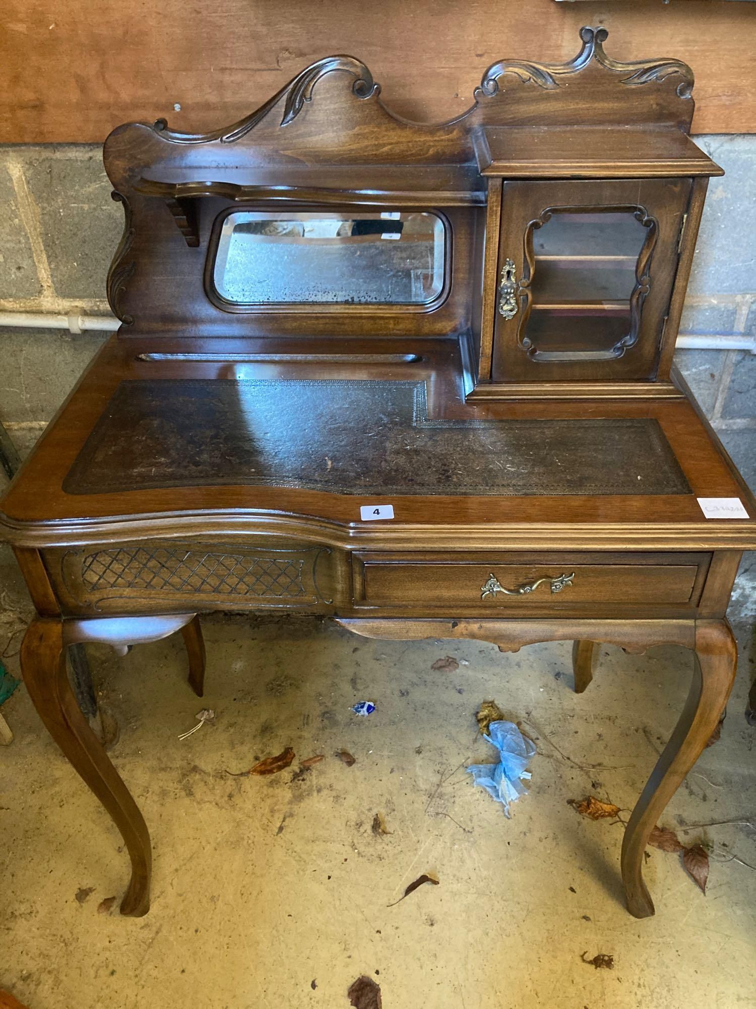 An early 20th century stained beech writing table, with raised superstructure, width 77cm height 108cm